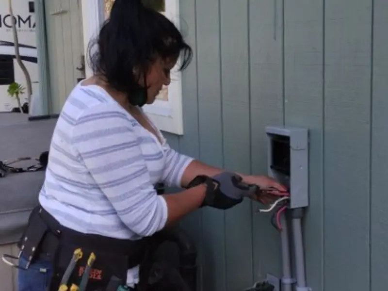 Licensed electrician wiring an exterior subpanel in Bridgeport